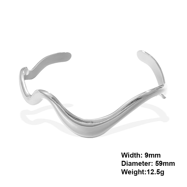 A rhodium plating wave design stainless steel bangle bracelet