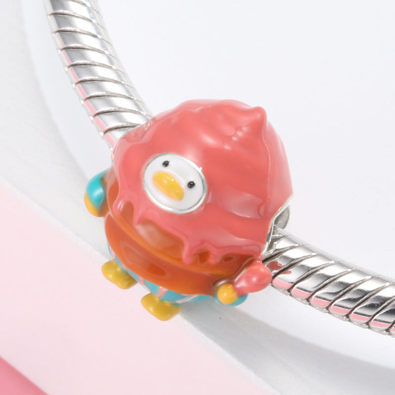 A sterling silver colorful enamel cupcake duck charm