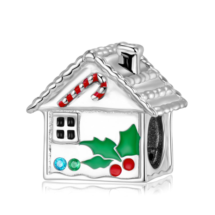 A sterling silver red and green enamel gingerbread house charm