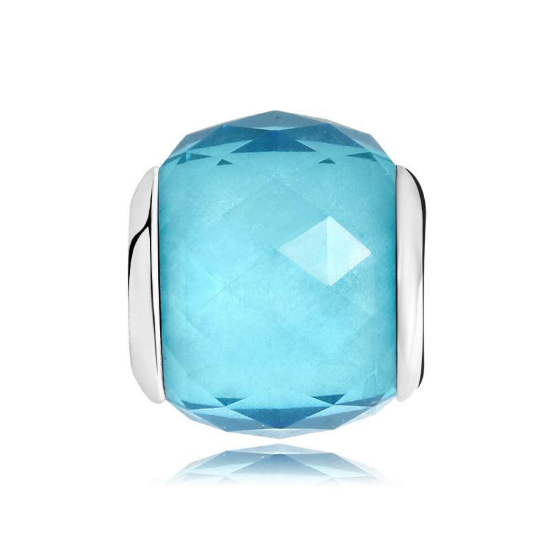 A sterling silver light blue facet sparkling round glazed charm