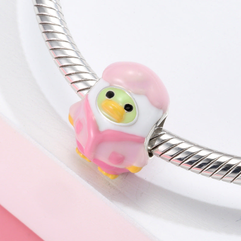 A sterling silver colorful enamel duck wearing pink suit charm