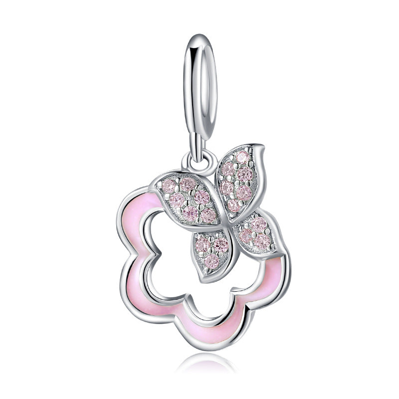 A sterling silver light pink enamel butterfly with paved pink zirconias butterfly hanging charm