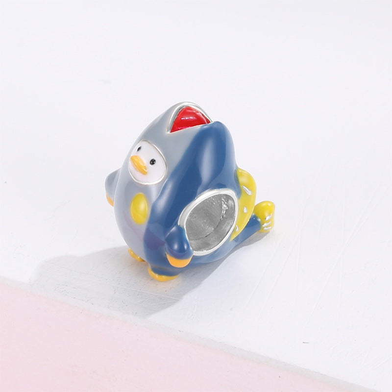 A sterling silver colorful enamel shark duck charm